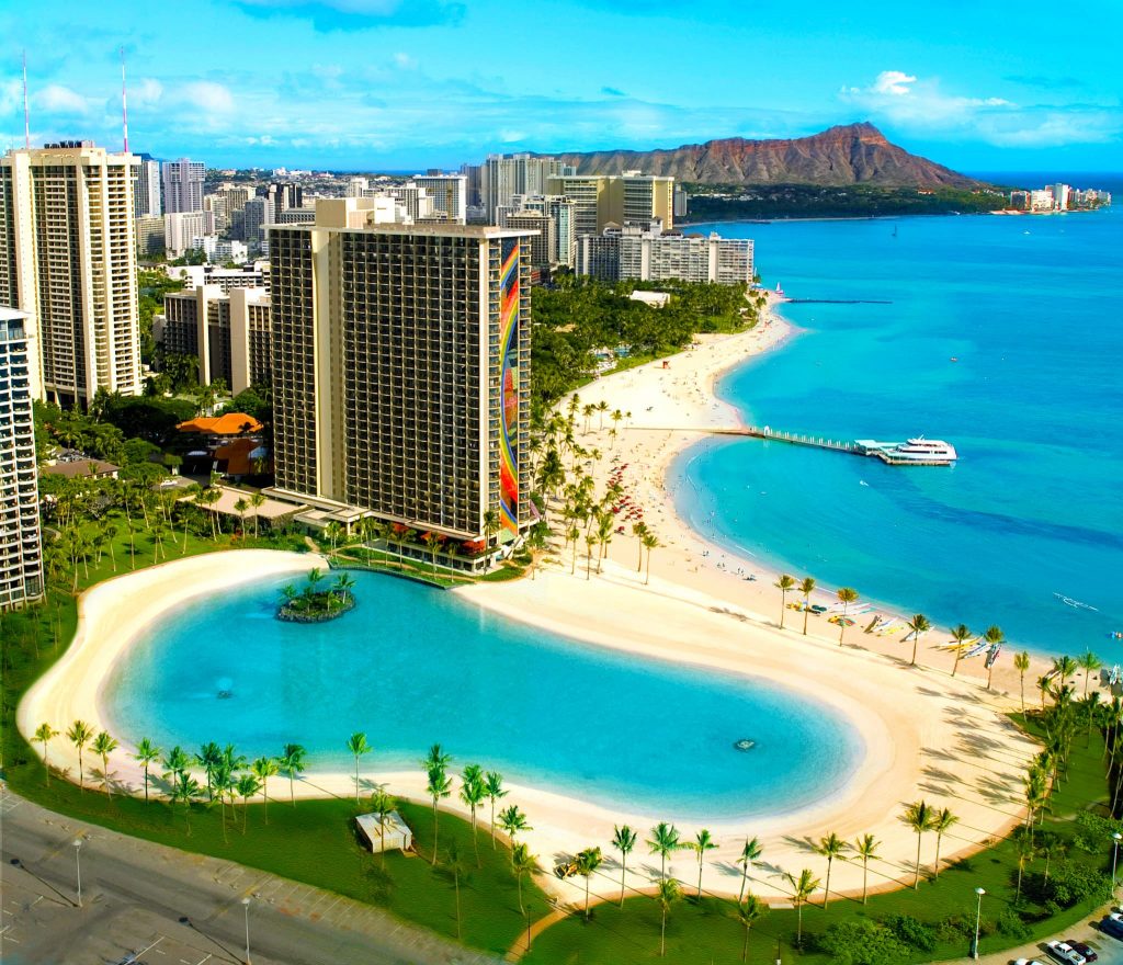 Hilton Hawaiian Village Resort hotel building on Waikiki Beach showing Diamond Head in the background 